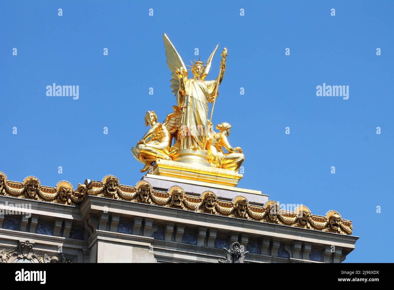 Charles Gumery's gilded sculpture La Poésie (Poetry), shines in the sunlight atop the roof of the Palais Garnier (Paris Opera House) in Paris, France. Stock Photo