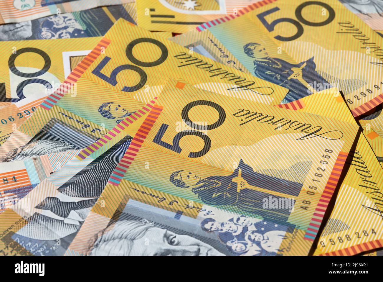 Closeup of many Australian 50 dollar notes. Shallow depth of field Stock Photo