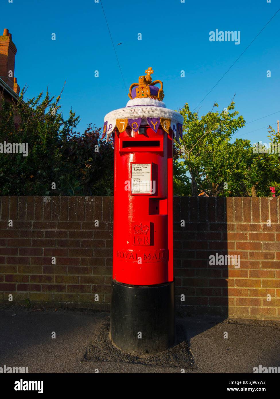 Weymouth, Dorset, UK.  20th May 2022.  A post box at Weymouth in Dorset has been decorated with a crochet state crown to celebrate the Queen’s Platinum Jubilee. The Platinum Jubilee of Elizabeth II is being celebrated from June 2 to June 5, 2022, in the UK and Commonwealth to mark the 70th anniversary of the accession of Queen Elizabeth II on 6 February 1952.  Picture Credit: Graham Hunt/Alamy Live News Stock Photo