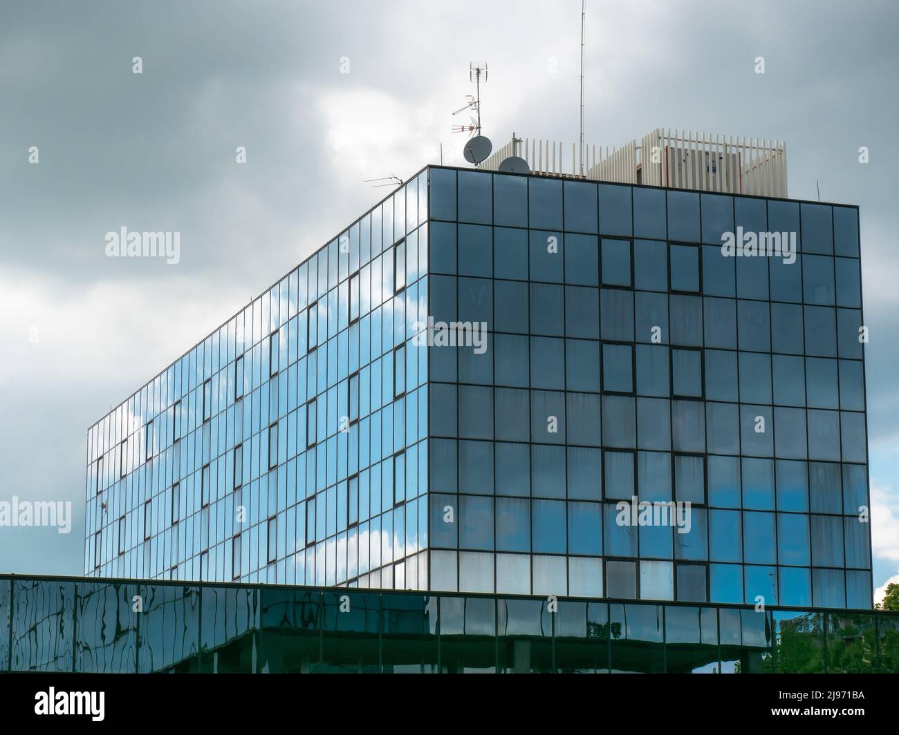 Blue Sky and Clouds Reflected in the Glass Building Stock Photo - Alamy