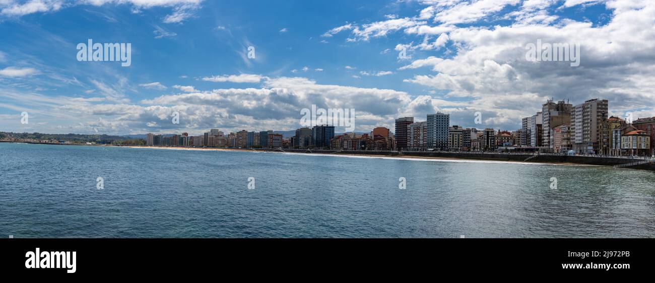 Gijon, Spain - 24 April, 2022: panorama cityscape of Gijon and the San Lorenzo beach Stock Photo