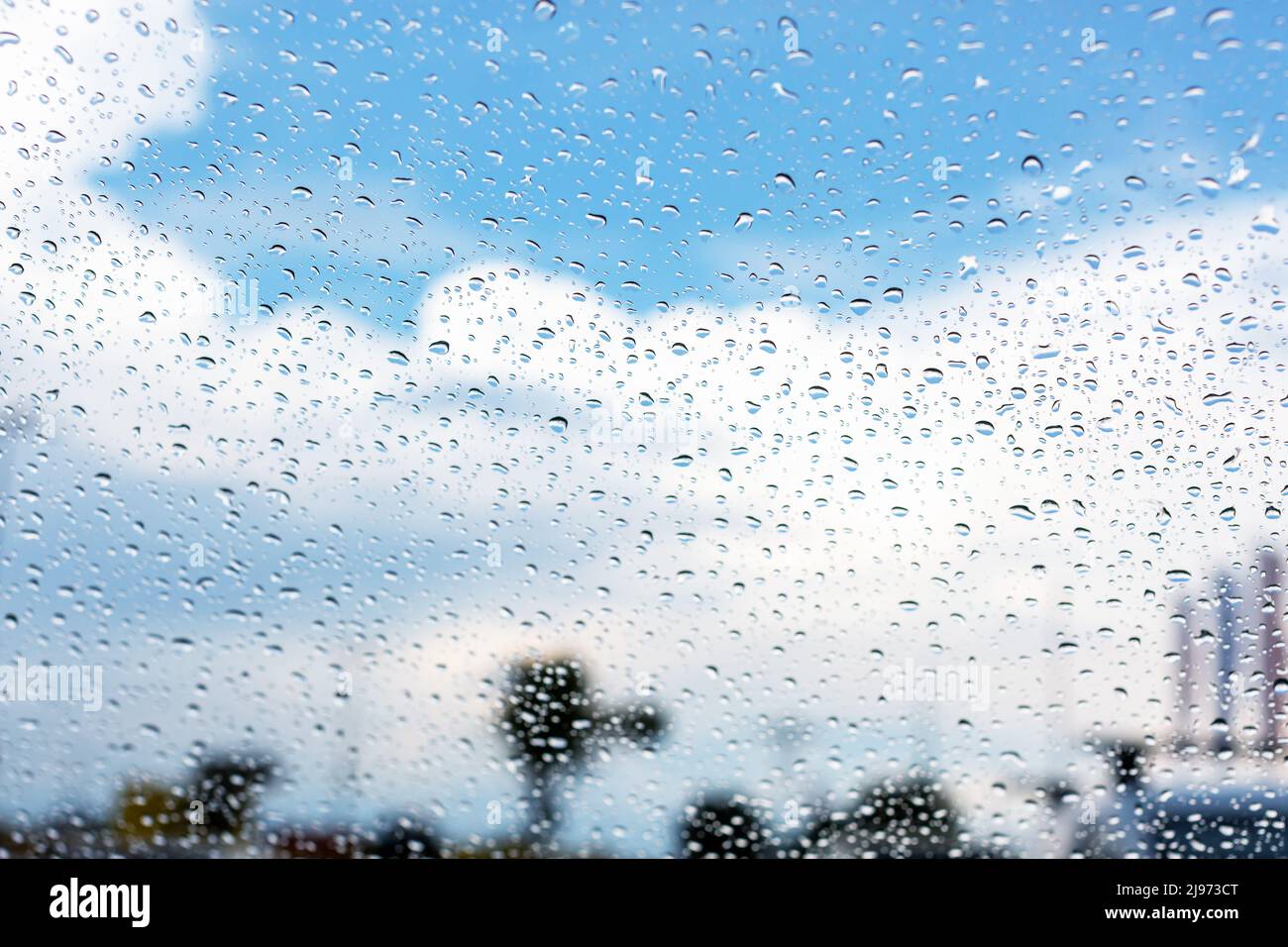 Looking through car windshield with rain drops. Background Stock Photo