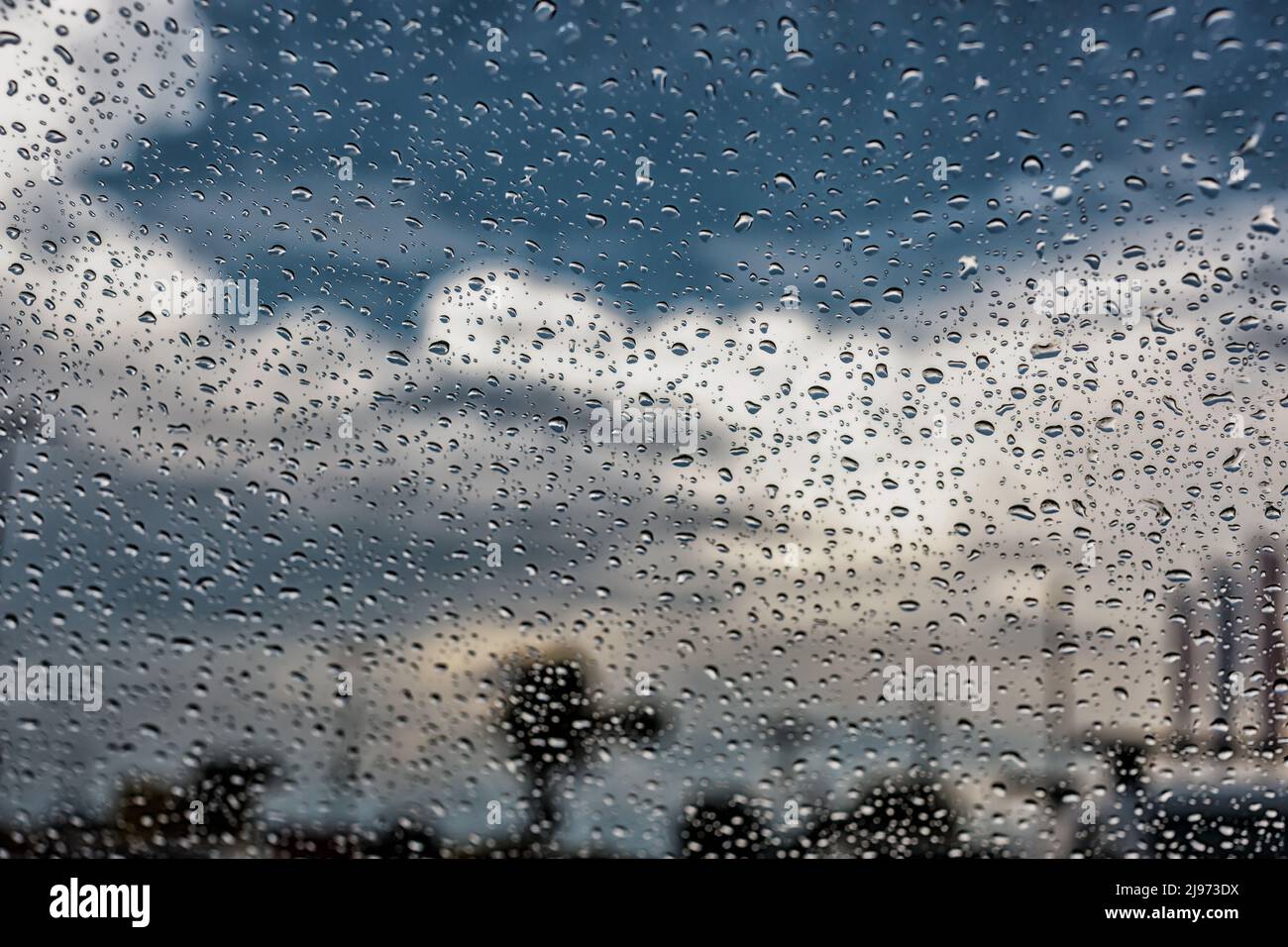 Rain drops on car windshield. Storm shower, thunderstorm Stock Photo