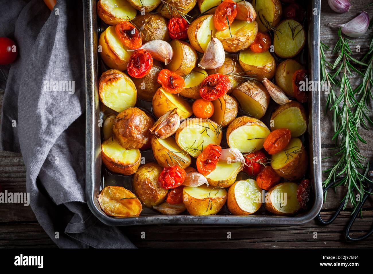 Tasty baked potatoes made of fresh vegetables and herbs. Roasted