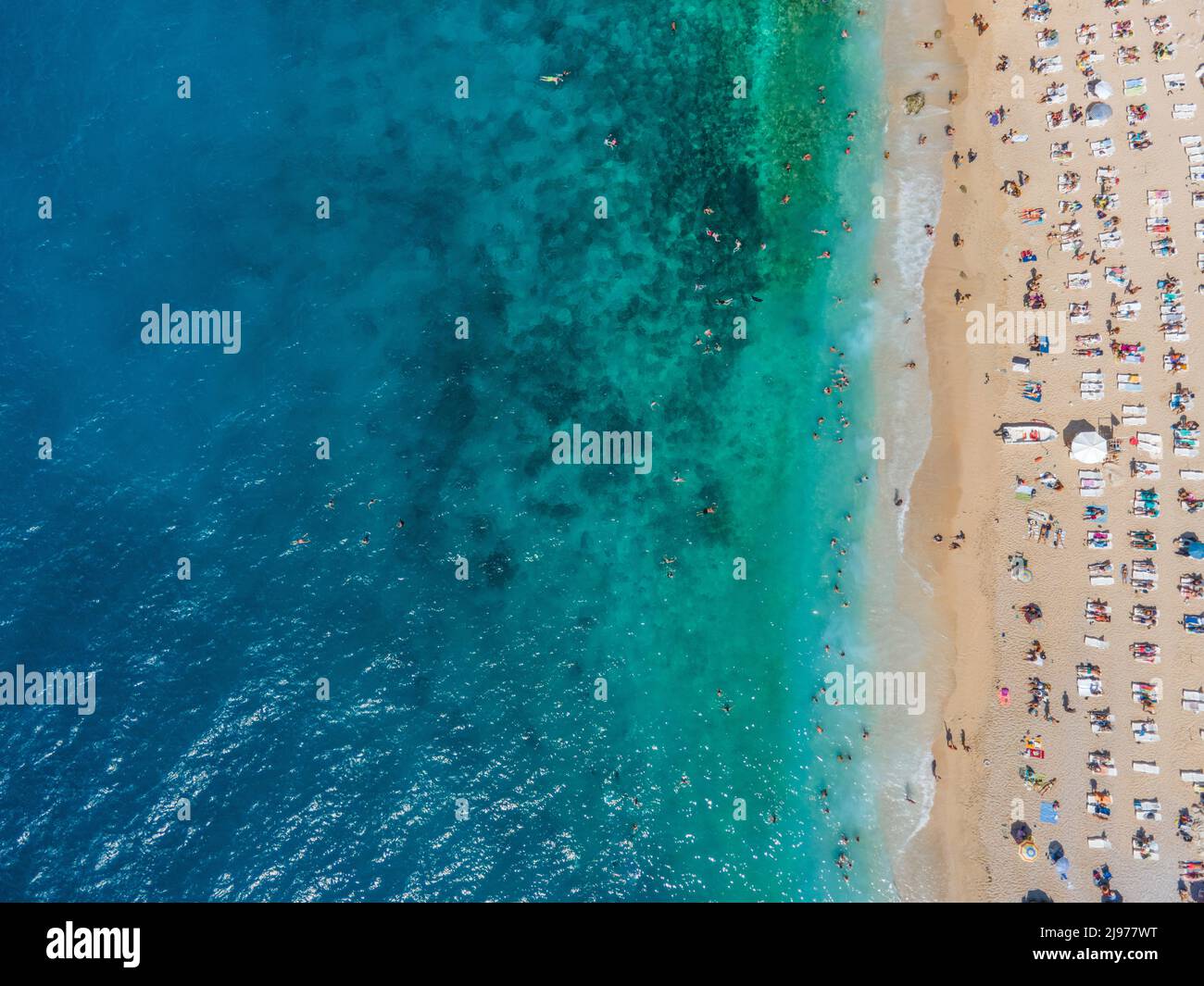 Drone footage of people sunbathing on Kaputaş beach near Kalkan - Kaş, Antalya, Turkey Stock Photo