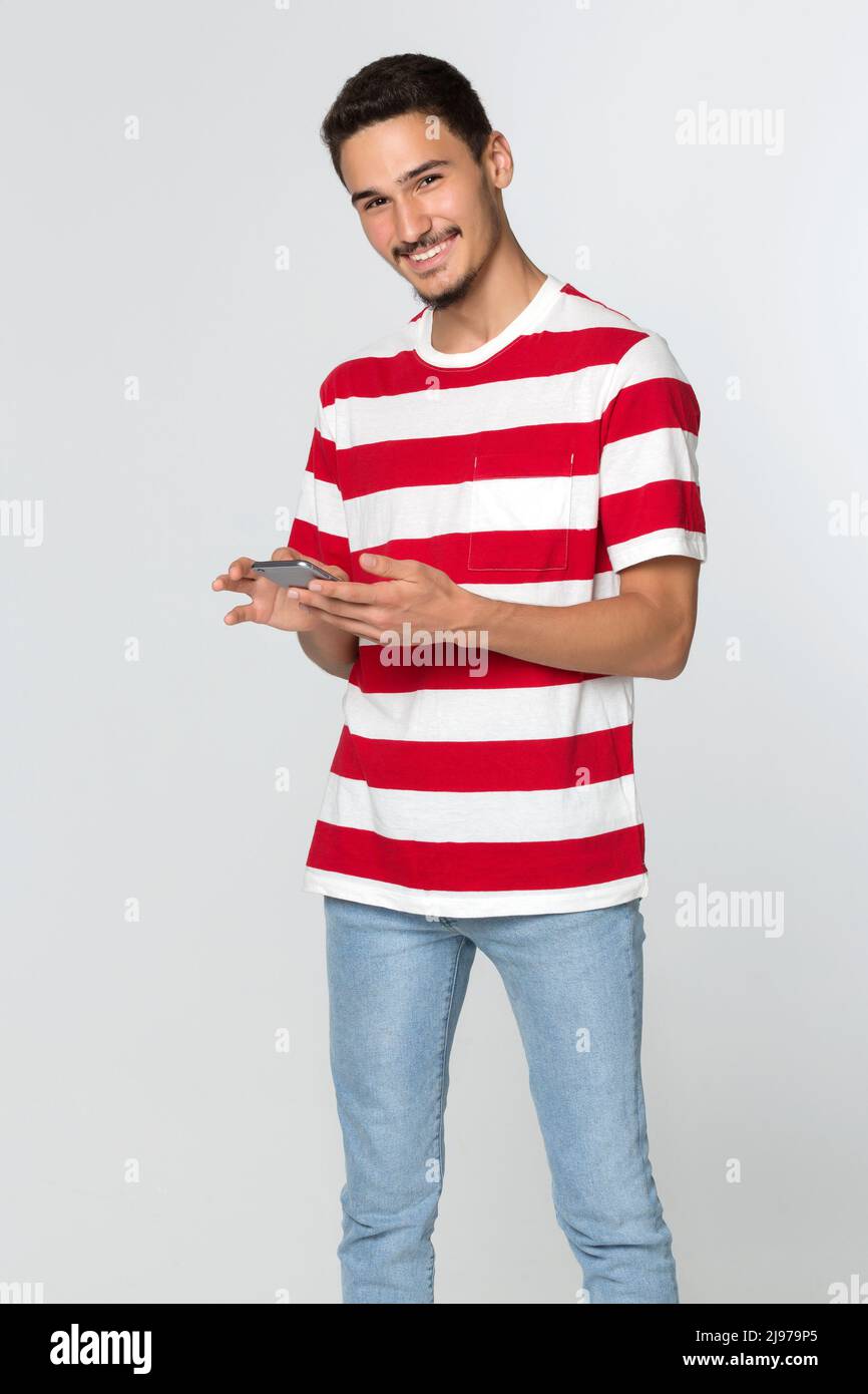Cute young man standing hi-res stock photography and images - Alamy