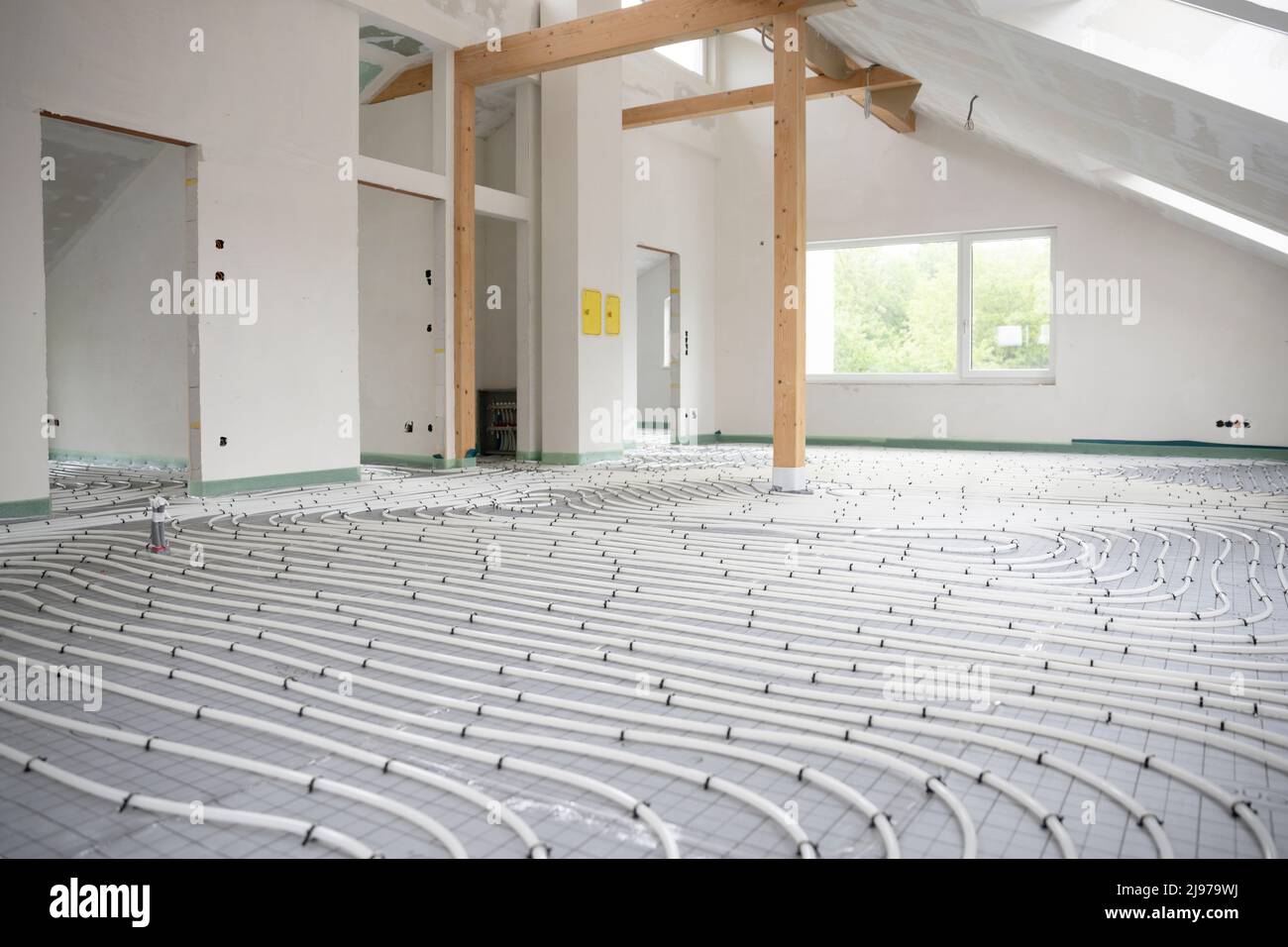 Shot of construction site in a loft where underfloor heating has just ...