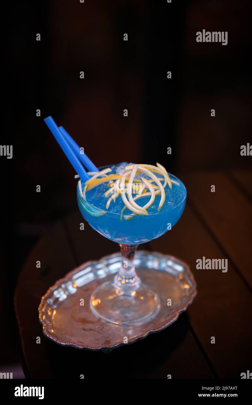 Blue Lagoon Coctail on the table made with Vodka, Blue Curaçao