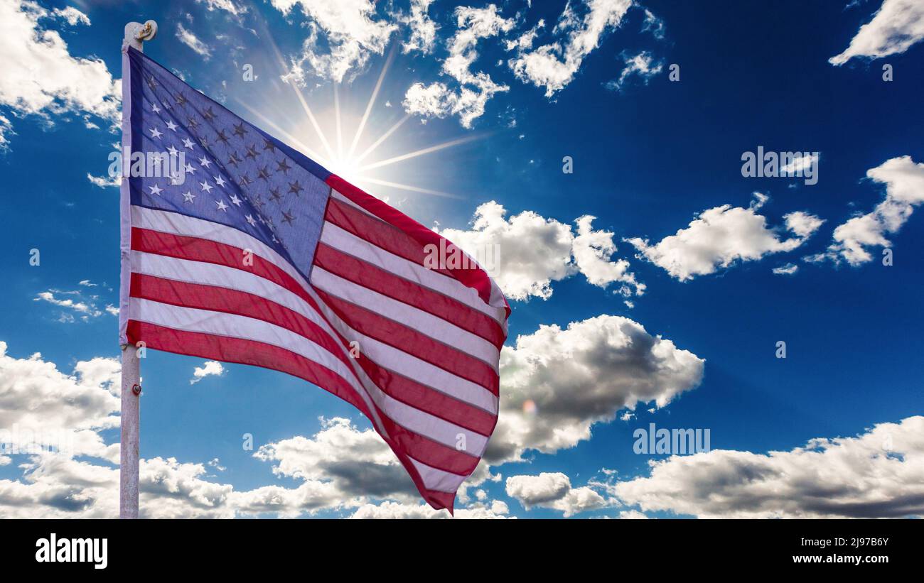 illustration of American Flag waving in sky backdrop Stock Photo - Alamy