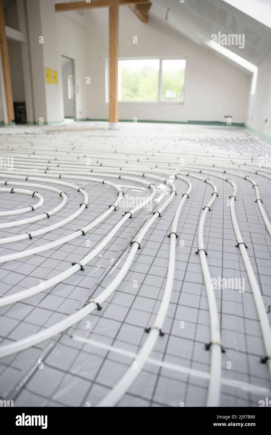 Shot of construction site in a loft where underfloor heating has just ...