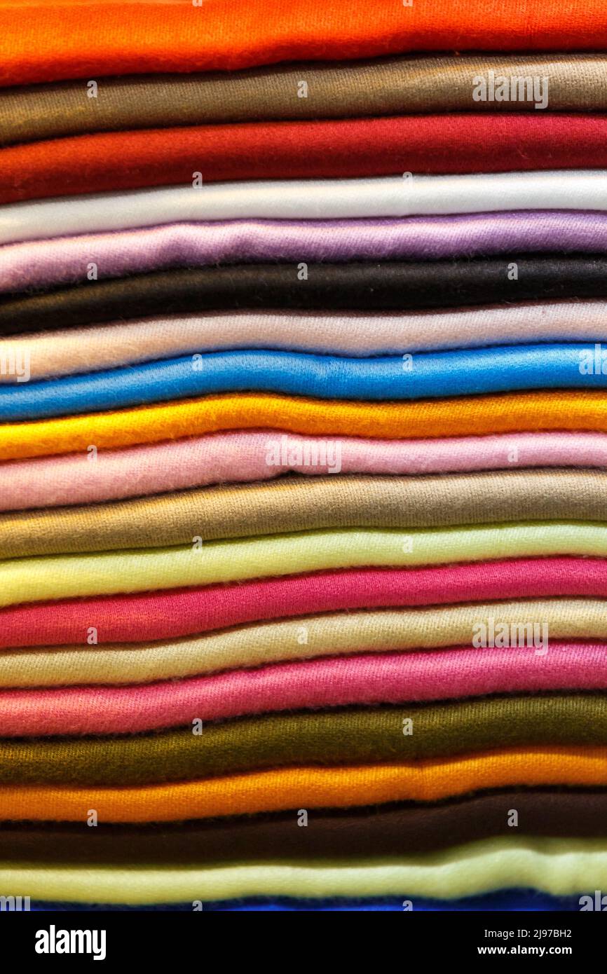Folded and stacked colored silk fabrics in Grand Bazaar, Istanbul Stock