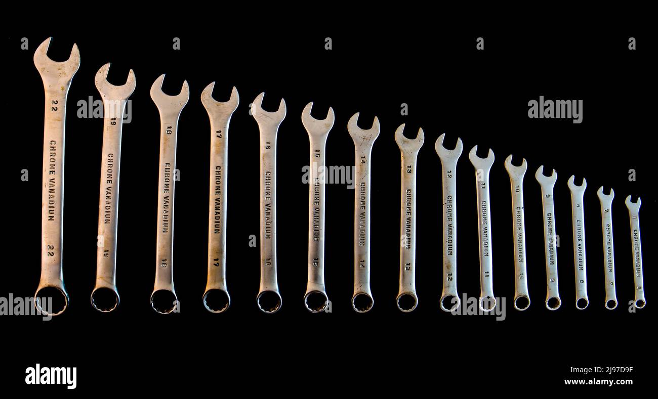 Old set of openend wrenches isolated on black Stock Photo Alamy