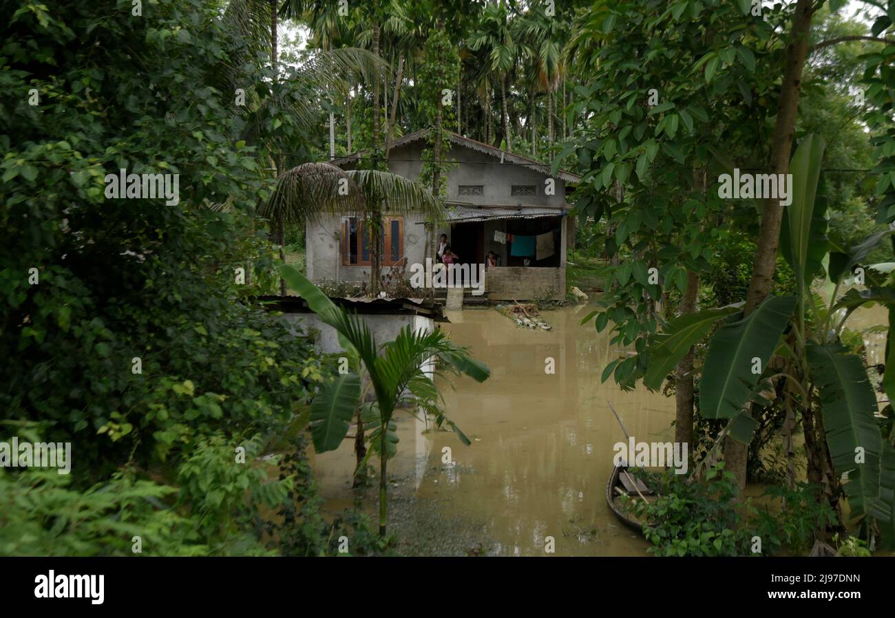 Assam, India. 20th May, 2022. A partially submerged house after flooding flowing heavy rainfall, in Nagaon, Assam, India on 20 May 2022. At least 10 people have died in floods and landslides due to pre monsoon rain in Assam. Credit: David Talukdar/Alamy Live News Credit: David Talukdar/Alamy Live News Stock Photo
