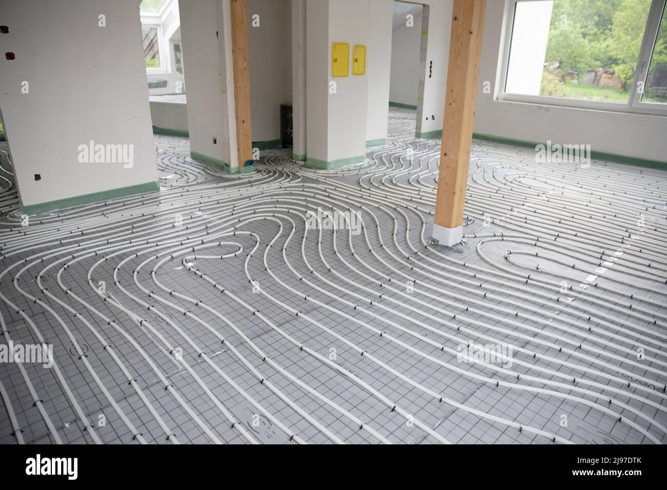 Shot of construction site in a loft where underfloor heating has just ...
