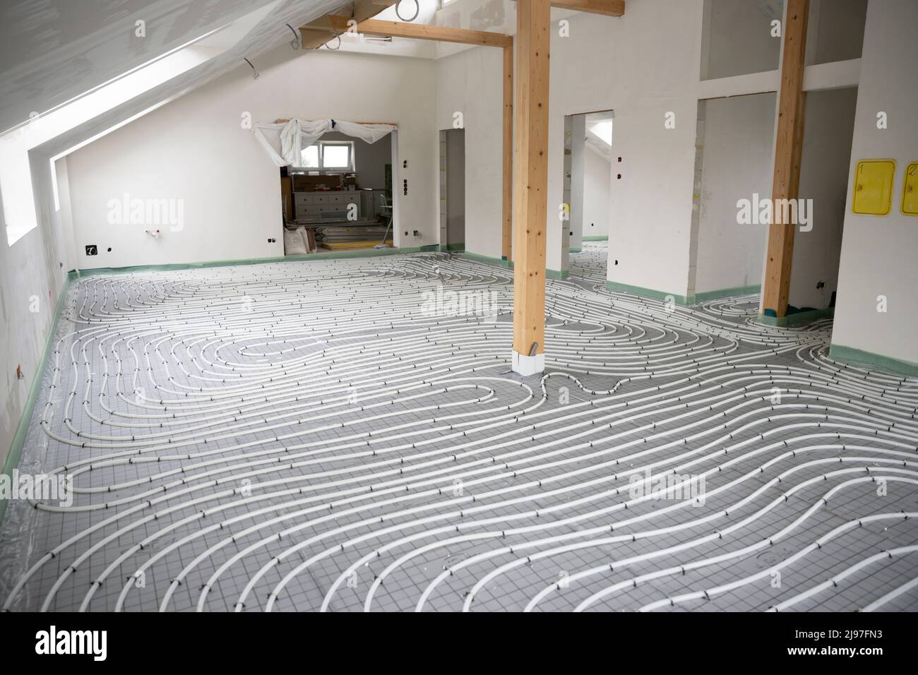 Shot of construction site in a loft where underfloor heating has just ...