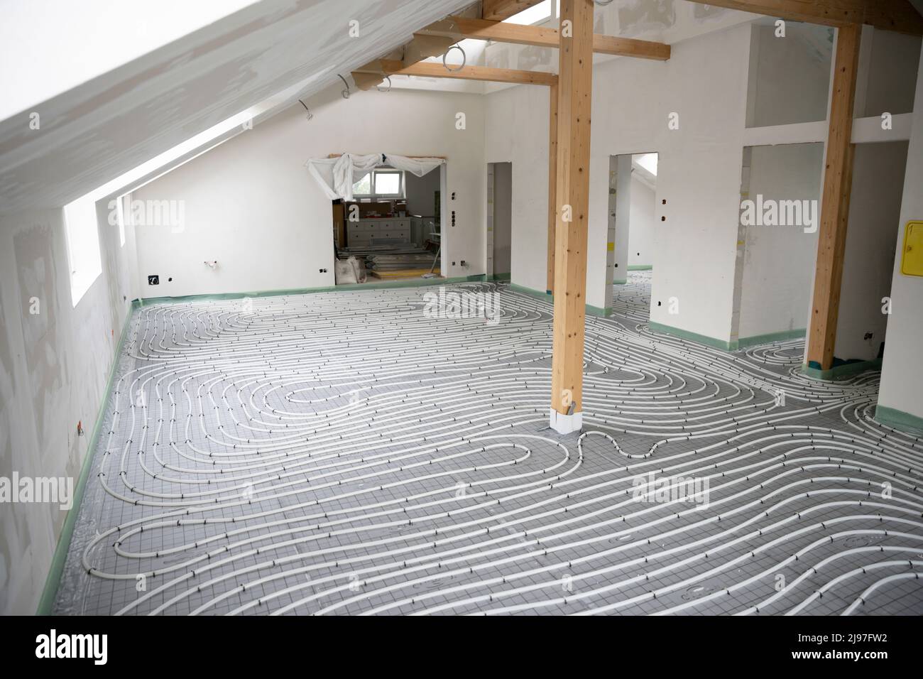 Shot of construction site in a loft where underfloor heating has just ...