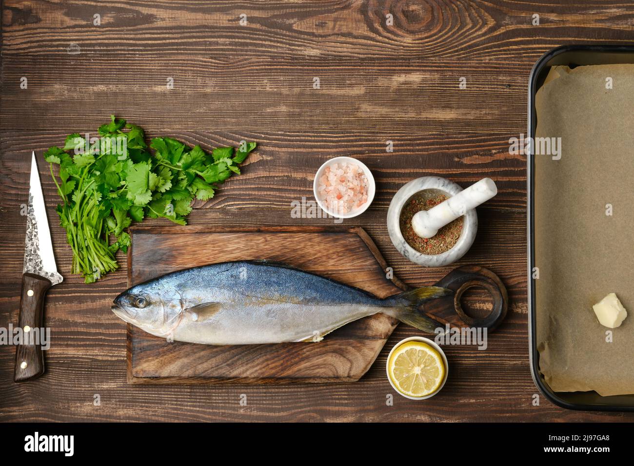 Fresh sea yellow tailed horse mackerel ready for cooking with ingredients, top view Stock Photo