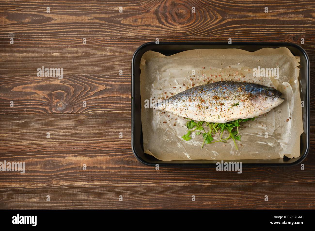 Fresh sea yellow tailed horse mackerel ready for cooking, marinated and seasoned, top view Stock Photo