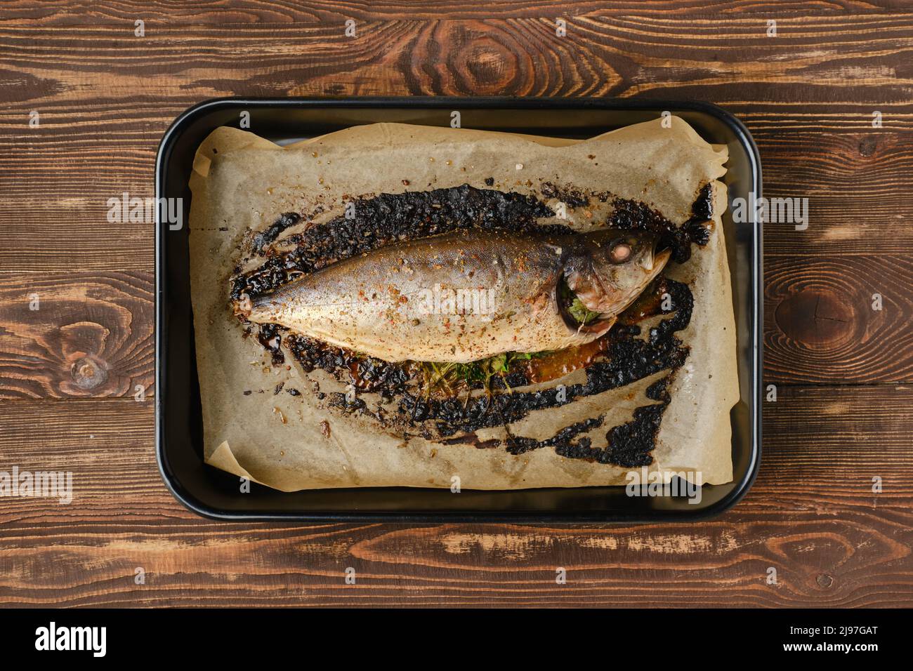 Baked sea yellow tailed mackerel in baking tray, top view Stock Photo
