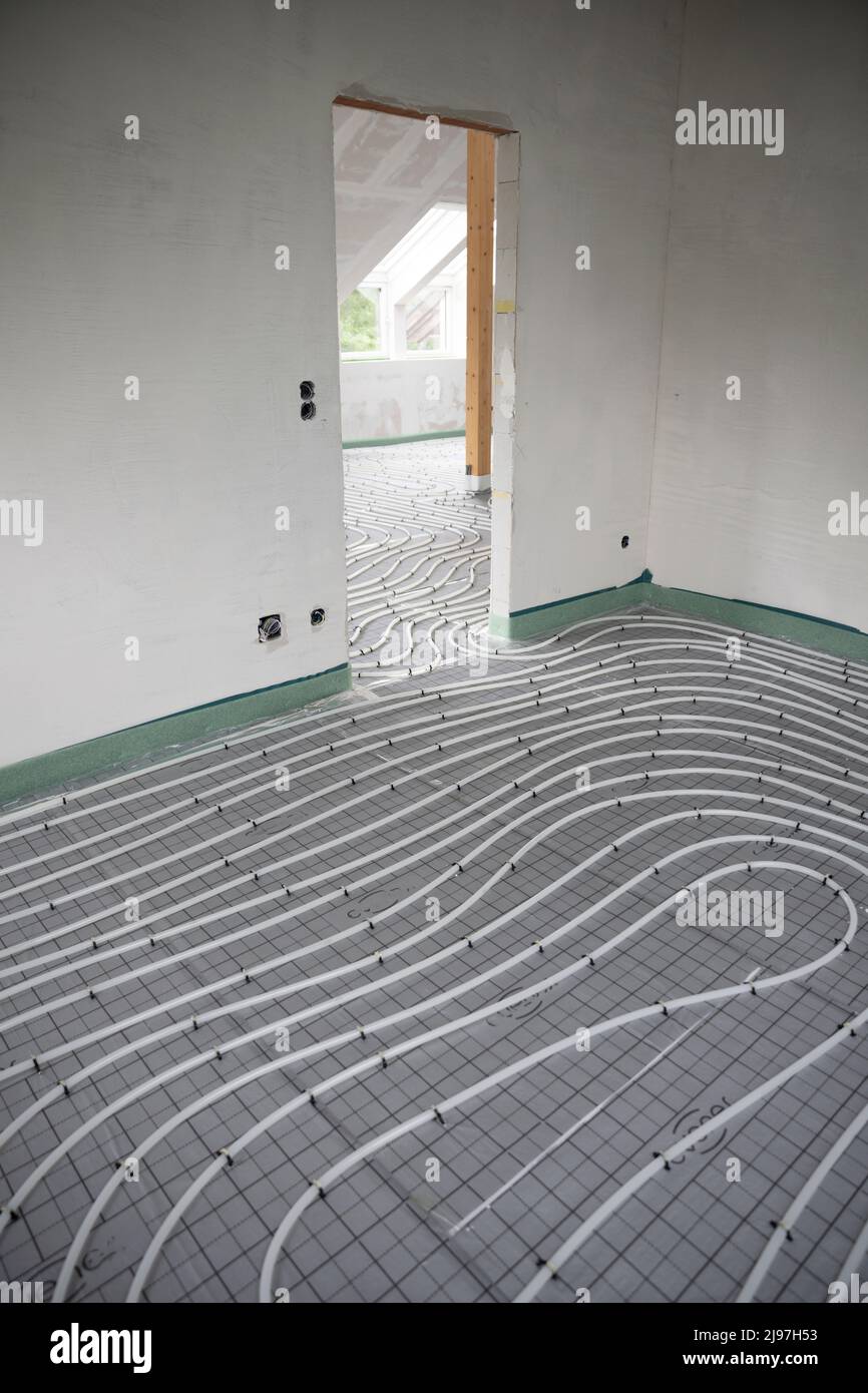 Shot of construction site in a loft where underfloor heating has just ...