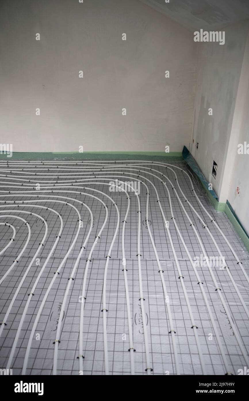 Shot of construction site in a loft where underfloor heating has just ...