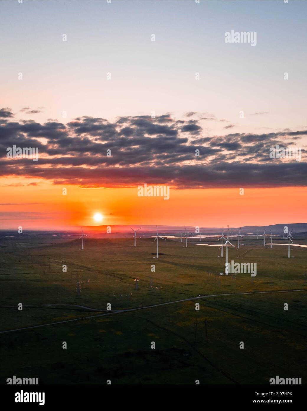 Wind turbine farm at sunset. Renewable energy concept Stock Photo - Alamy