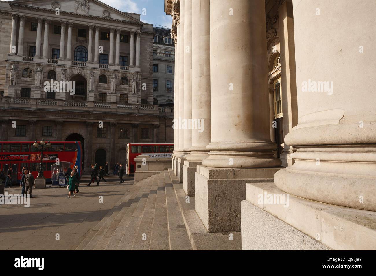 A view looking towards Bank of England with the column of the Royal Exchange on the right. Bank of England is the central bank of the United Kingdom. Stock Photo