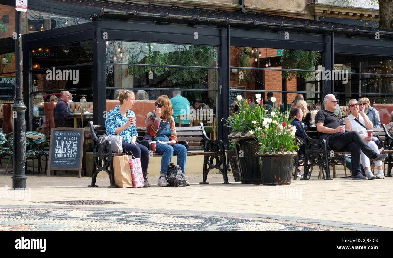 Visitors on Lytham square enjoying sun and ice cream Stock Photo Alamy