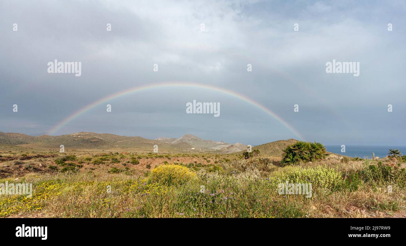 Rainbow at Cala Carbon beach, Cabo de Gata natural park, Andalusia, Spain Stock Photo