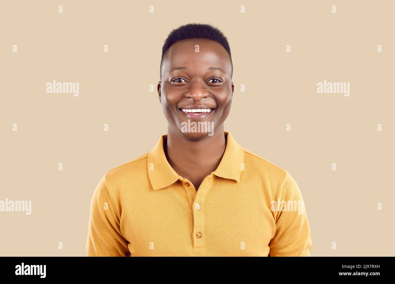 Portrait of happy handsome young African American man looking at camera and smiling Stock Photo