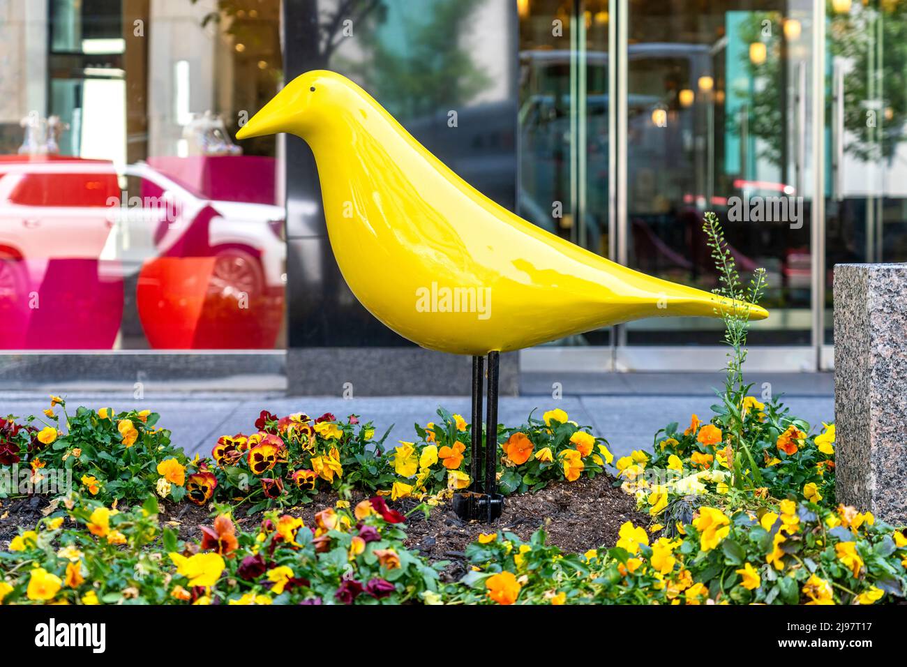 New bird shapes decorations in the gardens of Bloor Yorkville district. The series of ornament interchanges cool and warm color tones. Stock Photo