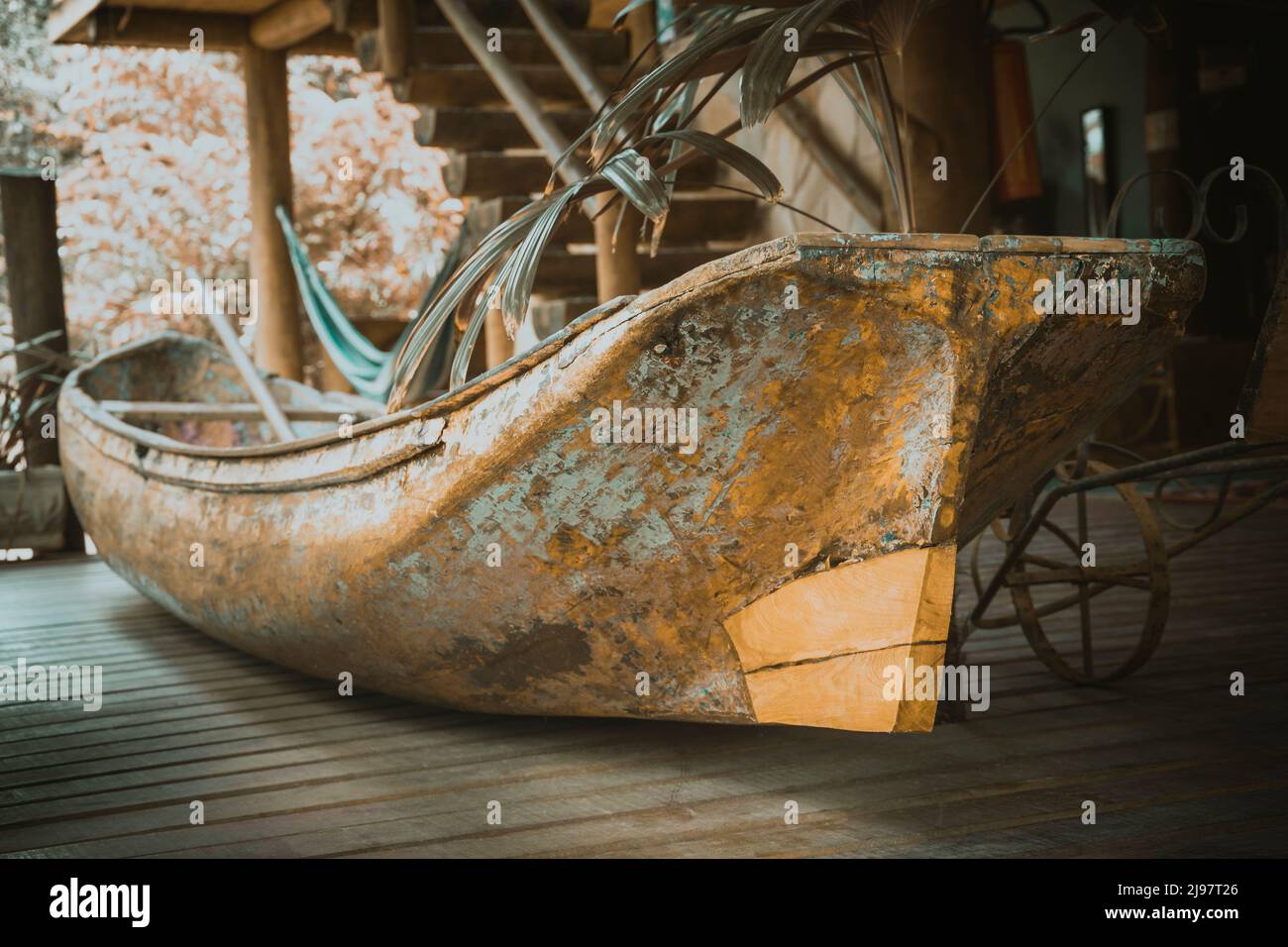 An old canoe used as a decorative element. Stock Photo