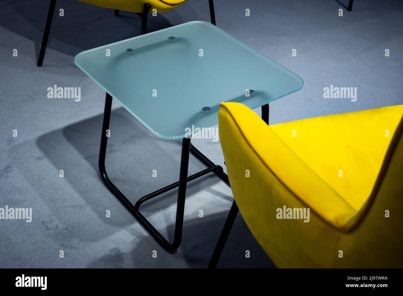 An empty meeting place during a pandemic. Colorful office chairs at the meeting place. Lack of people. Stock Photo
