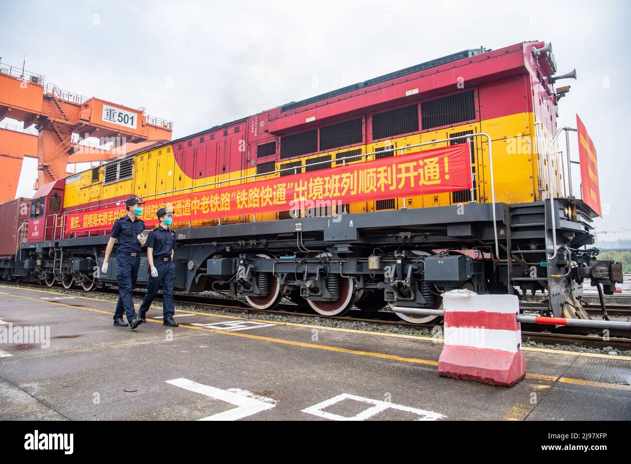 Chongqing, China. 21st May, 2022. (220521) -- CHONGQING, May 21, 2022 (Xinhua) -- Customs officers inspect a China-Laos cargo train before its departure in southwest China's Chongqing Municipality, May 21, 2022. A cargo train carrying local foods and agricultural machines departed from a station in southwest China's Chongqing Municipality for Laos' capital Vientiane on Saturday, marking the launch of the first China-Laos cargo train that enjoys a favorable quick entry and export channel. The quick entry and export channel save 24 hours in cargo clearance process, which helps shorten the journe Stock Photo