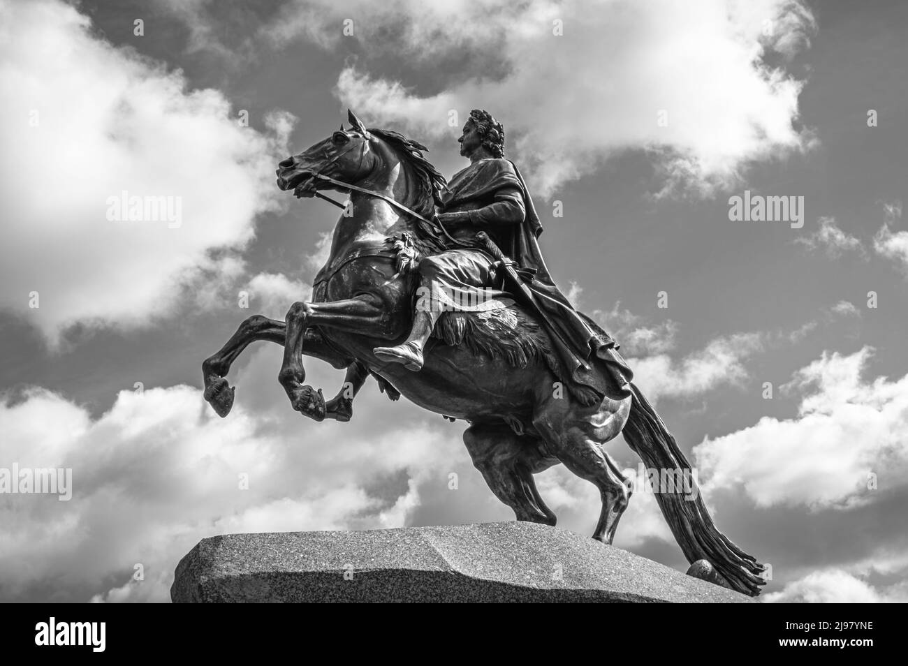 Bronze Horseman against cloudy skies. Monument to Peter the Great on Senate Square in the city of Saint Petersburg, Russia. Black and white. Stock Photo