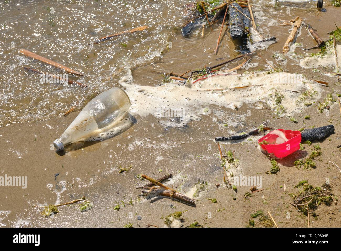 Garbage thrown out by waves beach, pollution of environment of human