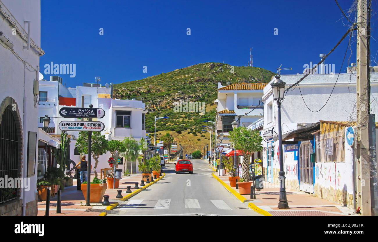 Zahara de los Atunes, Spain - June 1. 2019: Typical coastal spanish atlantic ocean white idyllic village, empty streets, green hill, blue sky Stock Photo