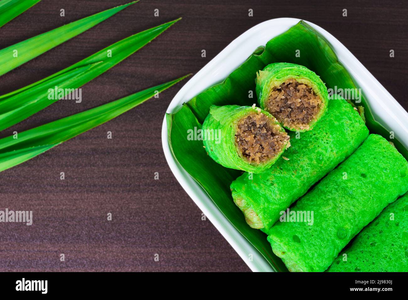 Malaysia popular assorted sweet dessert with coconut known as kuih ketayap. Stock Photo