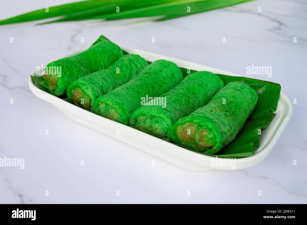 Malaysia popular assorted sweet dessert with coconut known as kuih ketayap. Stock Photo