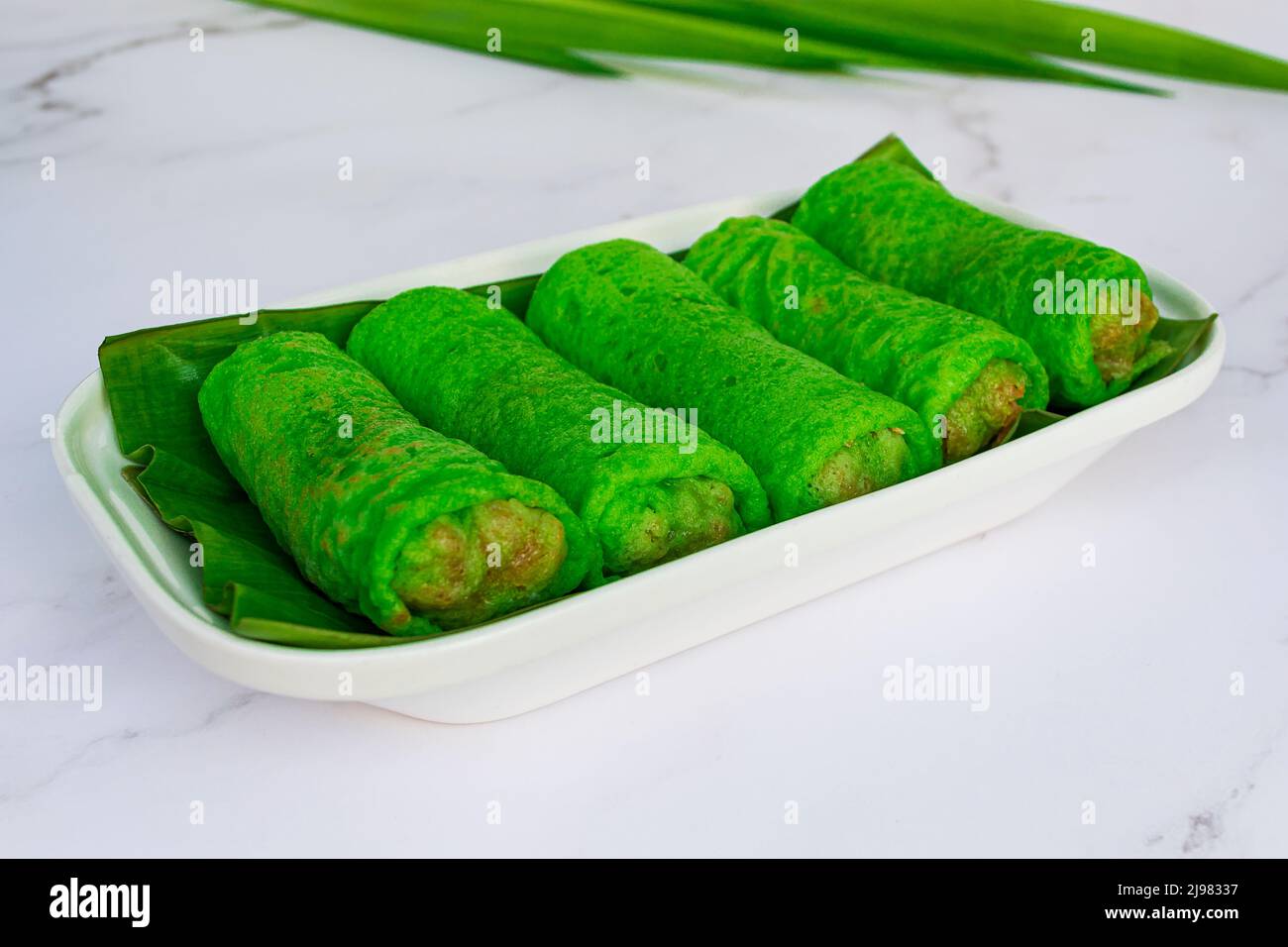 Malaysia popular assorted sweet dessert with coconut known as kuih ketayap. Stock Photo