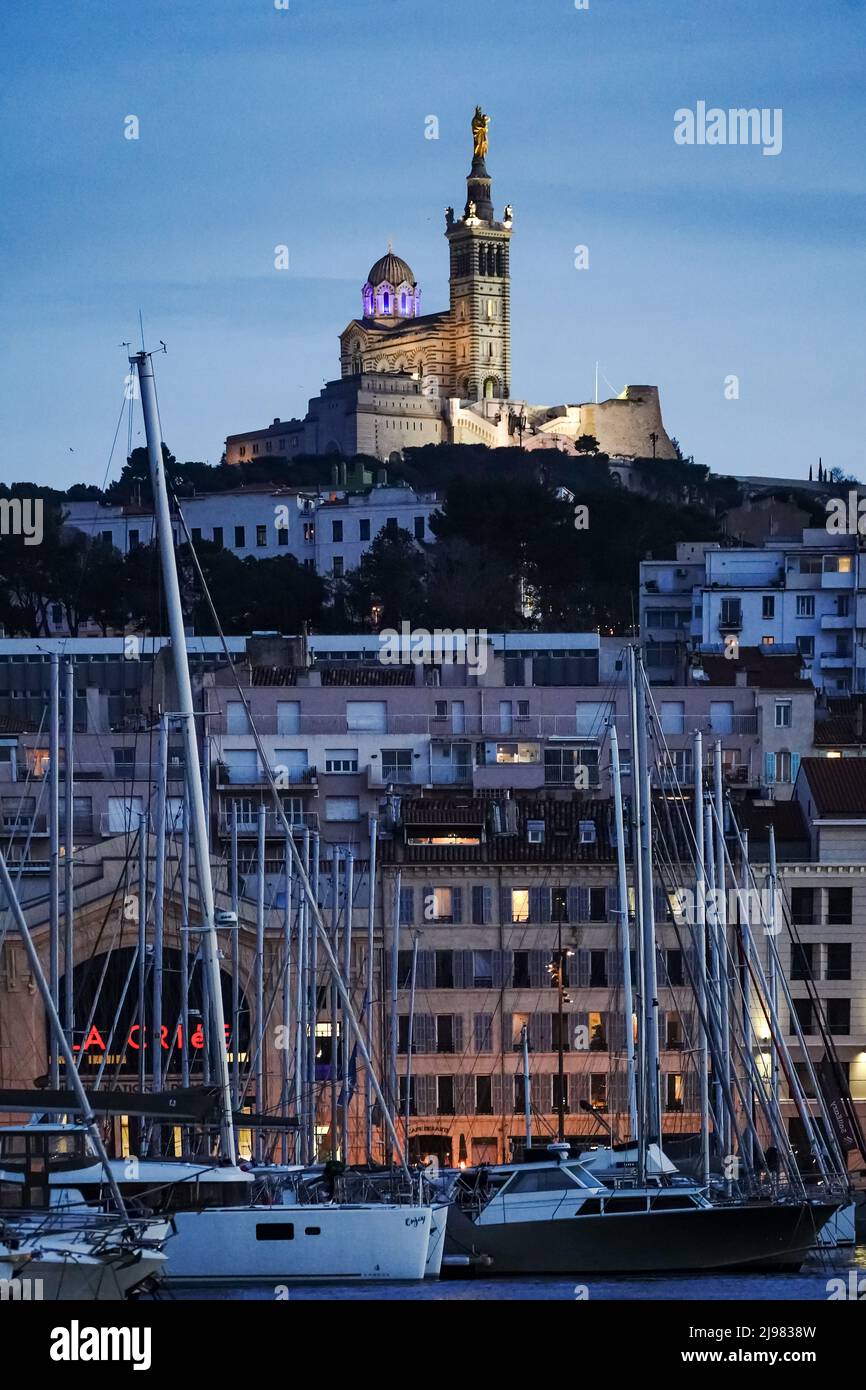 France. Marseille. Bouche-du-Rhone (13). Basilica Our Lady of the Guard and the old port at sunset Stock Photo