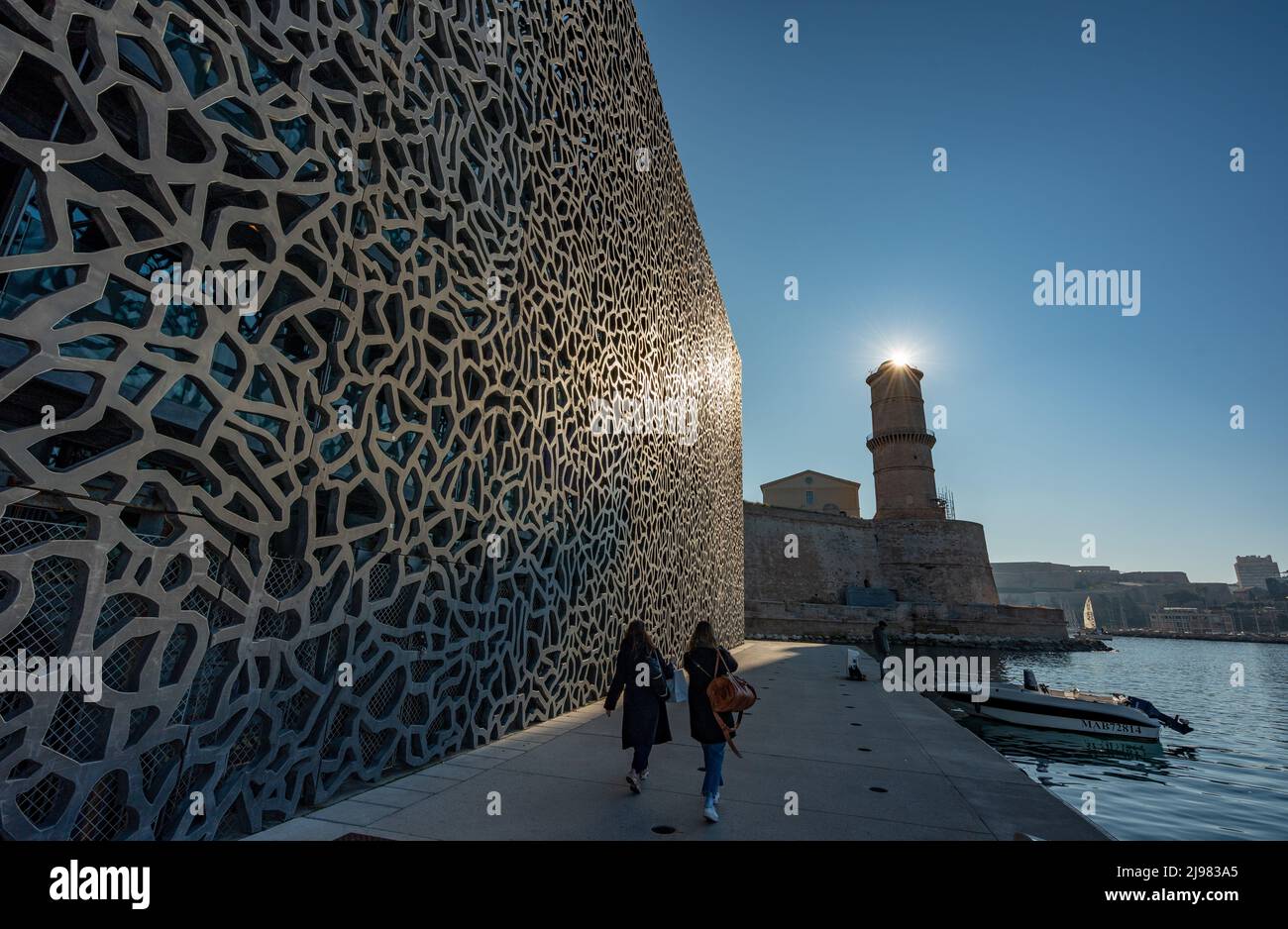 France. Marseille. Bouche-du-Rhône. The Mucem. People walking at Museum of European and Mediterranean Civilizations Fort Saint-Jean in the background Stock Photo
