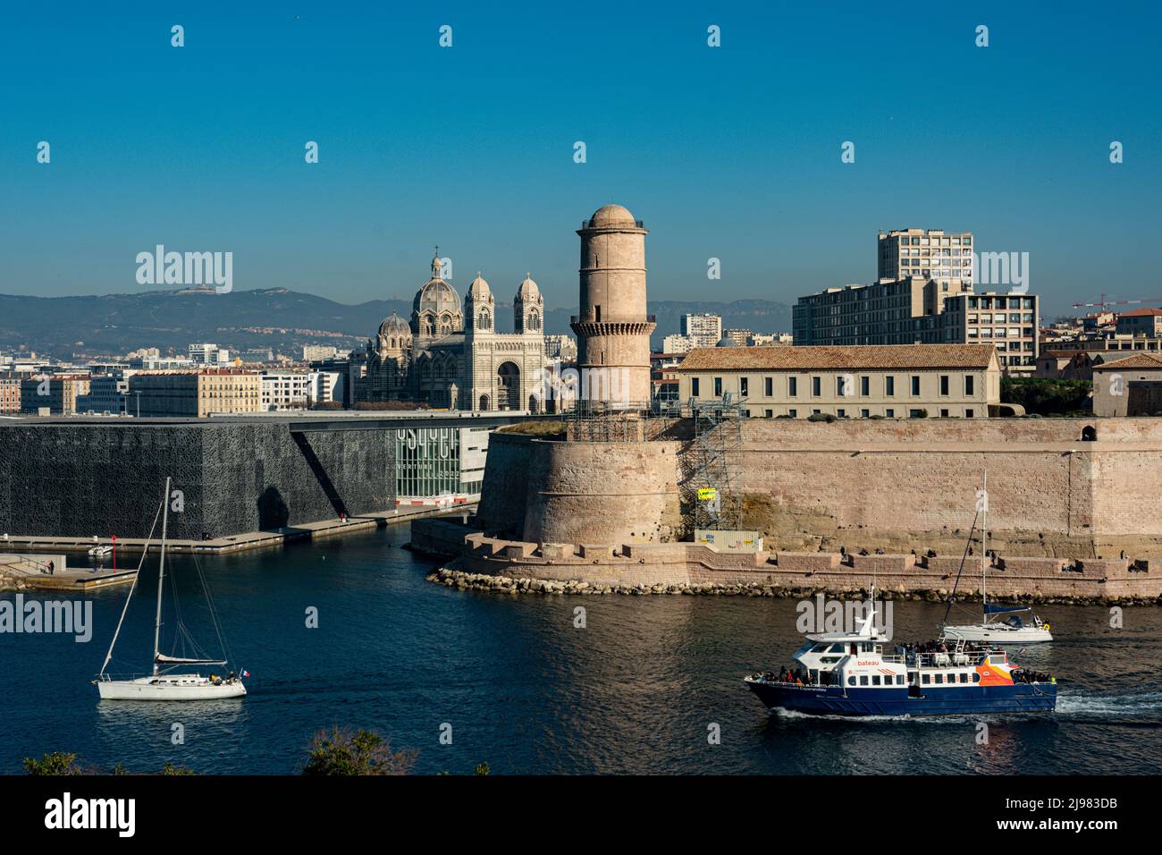 France. Marseille.The Mucem. Museum of European and Mediterranean Civilizations the Fort Saint Jean and in the background La Major Cathedral Stock Photo