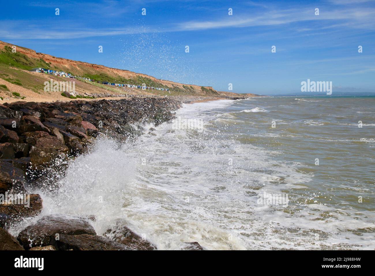 Waves and shoreline Barton on Sea, Hants, UK May 2022 Stock Photo