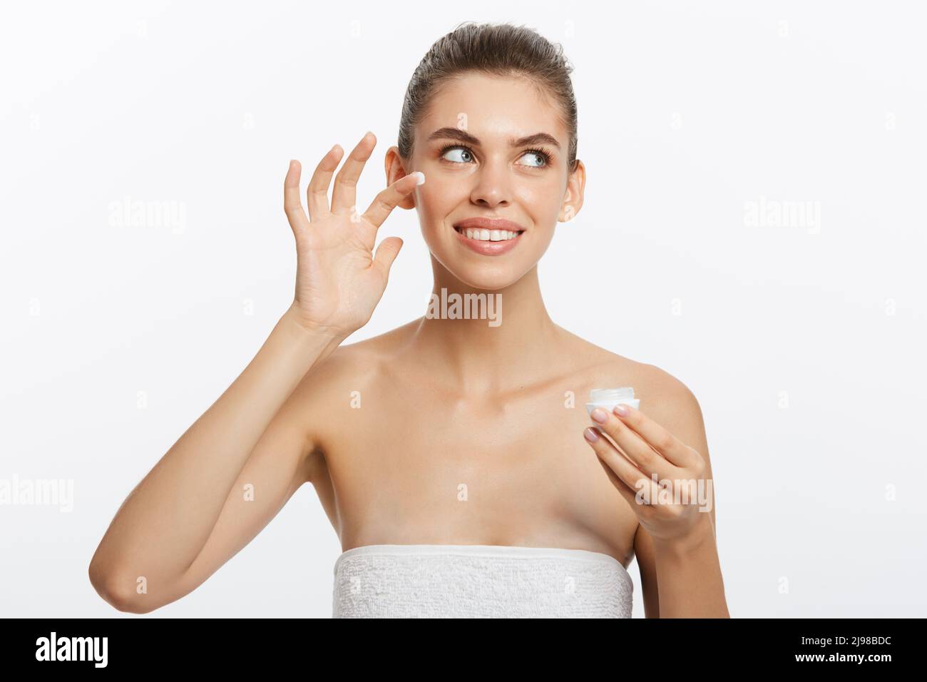 Beautiful Young Woman with Clean Fresh Skin look away. Girl beauty face ...
