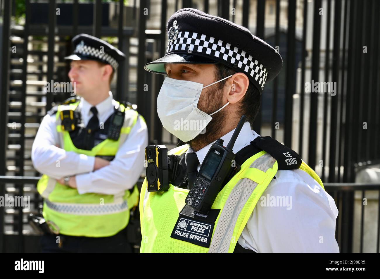 London, UK. Metropolitan Police Officers guarded the entrance to Downing Street. An Anti-Vax march took place in Central London today culminating in a rally outside the gates of 10 Downing Street. Stock Photo