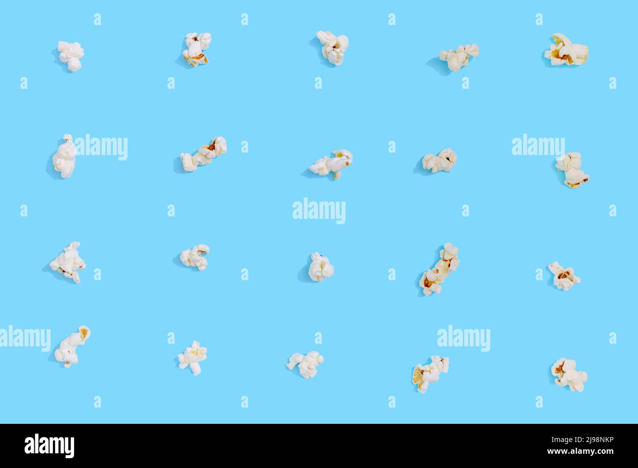 Popcorn seamless pattern on blue background. Top view Stock Photo