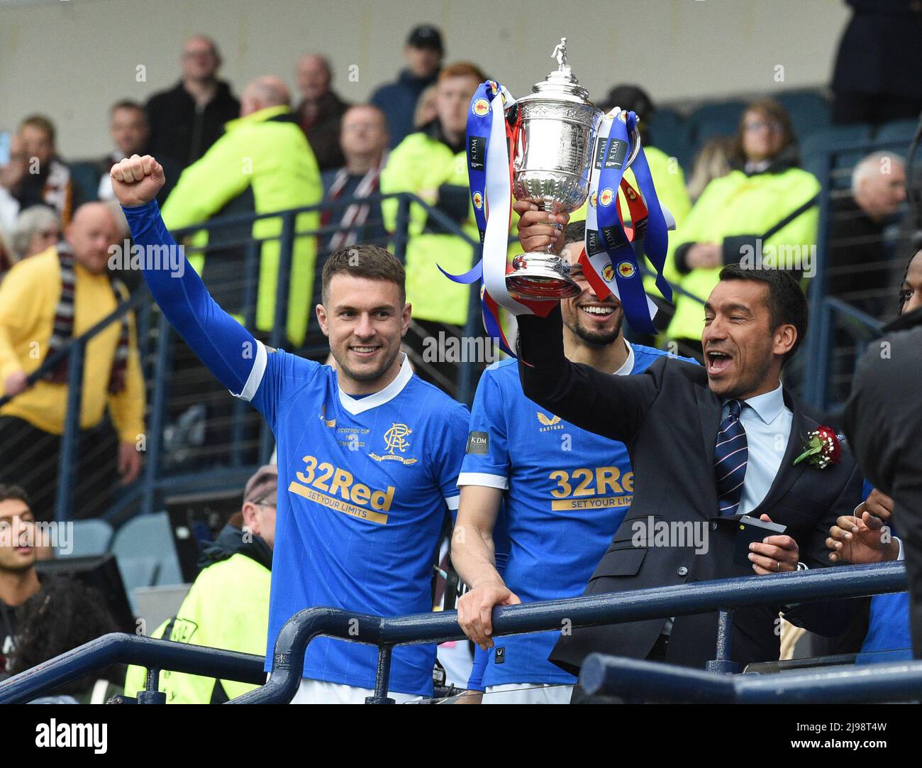 Hampden Park.Glasgow.Scotland, UK. 21st May, 2022. Rangers vs Heart of Midlothian. Scottish Cup Final 2022 Giovanni van Bronckhorst, manager of Rangers FC lifts the trophy looking on Aaron Ramsey (#16) of Rangers FC vs Hearts. Credit: eric mccowat/Alamy Live News Stock Photo