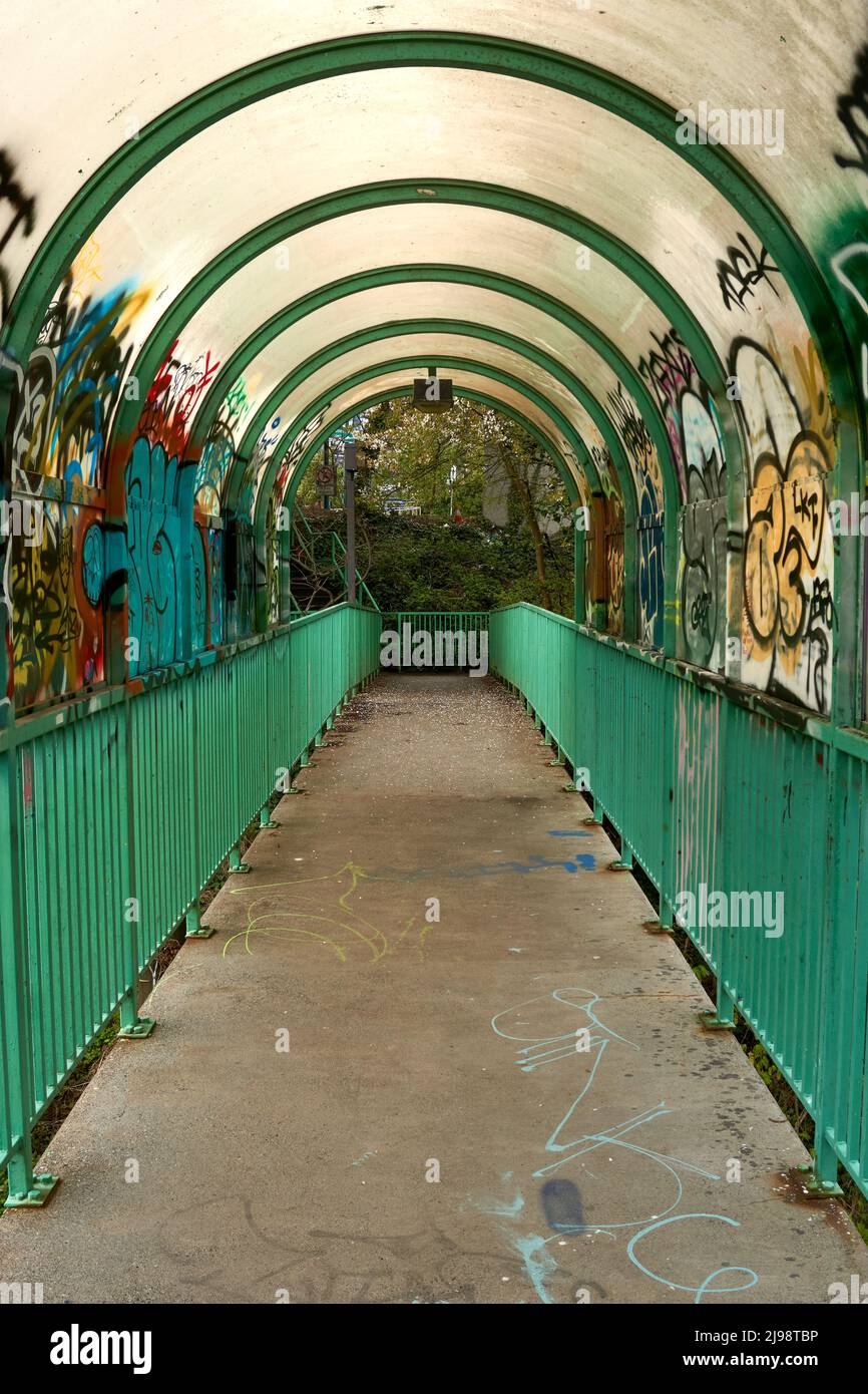 Covered pedestrian walkway with graffiti, Vancouver, BC, Canada Stock Photo