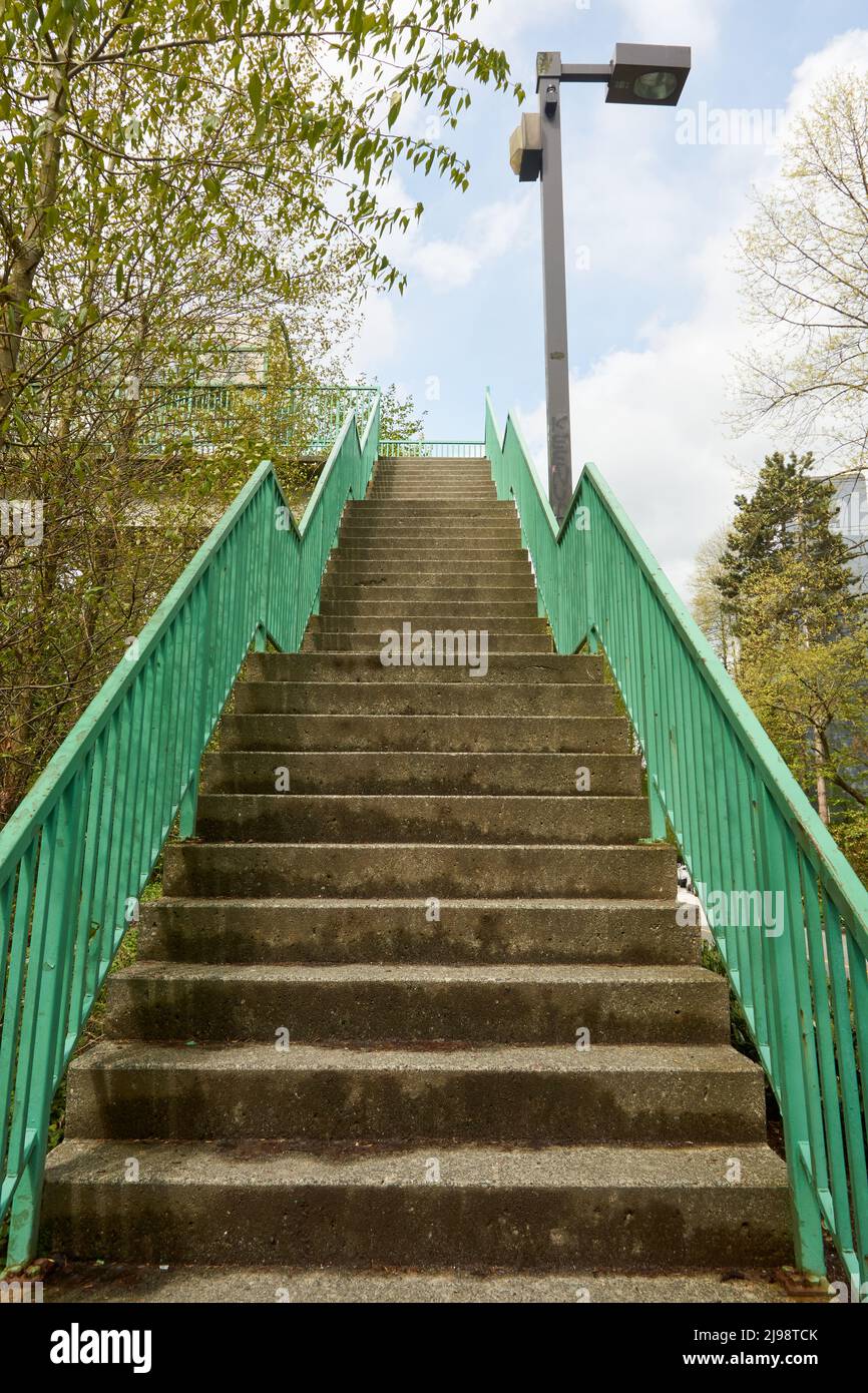 Empty steep concrete outdoor staircase from below Stock Photo